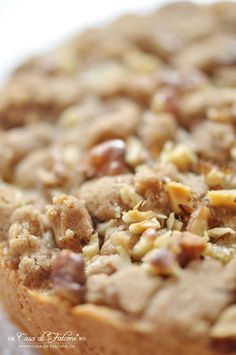 a close up view of a pie with nuts on it's crusty crust