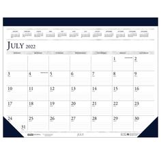 a desk calendar with the word july in blue and white, on a white background