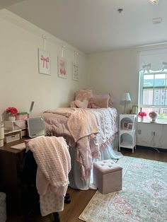 a bedroom with two beds and a rug on the floor