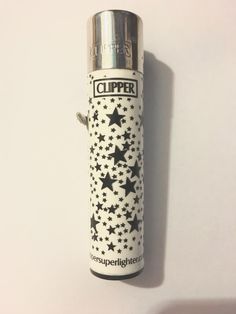 a white and black lighter with stars on it