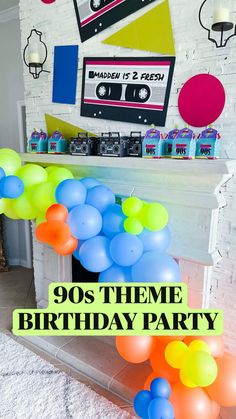 a birthday party with balloons and streamers in front of a fireplace that reads 90's theme birthday party