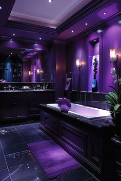 a bathroom with purple lighting and a large bathtub in the middle of the room