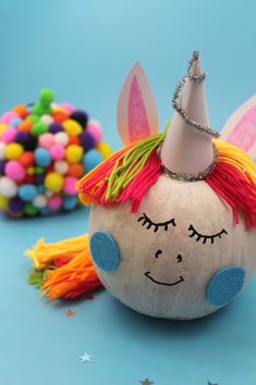 a close up of a toy with a unicorn's head on it