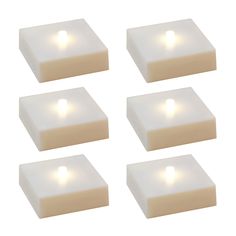 six pieces of white foam with lights on them