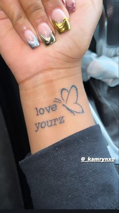 Love yourz tattoo on wrist dainty minimalistic butterfly j Cole song positive quote Butterfly On Wrist, Tattoo With Butterfly, Small Girly Tattoos, Hand Tattoos For Girls, Tattoo Wrist, Tattoo Butterfly, Strange World