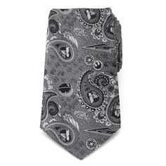 You'll enjoy hours of entertainment admiring the impressive detail of our Vader Paisley Gray Tie. Carefully stitched in gray, black, and white silks, our design features miniature Darth Vader helmets, Imperial and Rebellion icons, Stormtroopers, a flying Millennium Falcon, and so much more in a classic, yet nerdy paisley design. How many details can you find? Our tie will maintain its shape and hold a sturdy knot thanks to the durable yet stylish 100% Polyester. Officially licensed by LucasFilm Tie Tying, Star Wars Tie, Vader Helmet, Darth Vader Helmet, Star Wars Design, Dark Vador, Paisley Tie, Millennium Falcon, Grey Tie