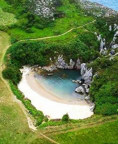 an aerial view of a beach with people on it