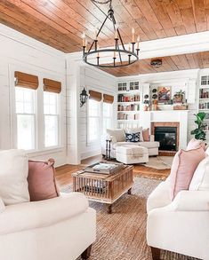 a living room filled with furniture and a fire place