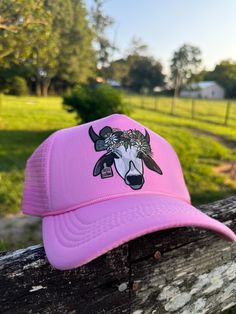 Floral Florida Brahman high crown trucker cap  My name is Hailey. I am a third-generation cattlewoman from central Florida! I created this page to share the pictures I capture while working cattle and every day on the ranch. I am incredibly passionate about the Florida cattle industry and want to share it with everyone! Here's a view of Florida ranch life through my lens! ||SOCIAL MEDIA || Follow all my social media accounts!  Facebook and Instagram: @ranchrevivalphotography Tiktok: @haileytomkow Don't forget to tag me!! Elevate your Western style with this classic Otto trucker hat, designed for those who appreciate both comfort and fashion. Crafted with a breathable mesh back and a sturdy, curved brim, this hat is perfect for long days under the sun. The adjustable snapback closure ensure Trucker Style Brimmed Baseball Cap, Pink Western Cap Hat, Western Style Pink Cap, Trucker Baseball Cap With Brim, Pink Western Style Cap, One Size Fits Most Trucker Baseball Cap, Spring Rodeo Trucker Hat, Spring Rodeo Trucker Hat, One Size Fits Most, Spring Rodeo Trucker Hat One Size Fits Most