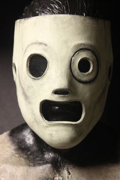 a creepy mask with big eyes and mouth