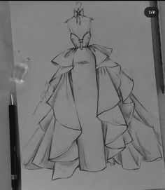 a drawing of a dress on top of a paper