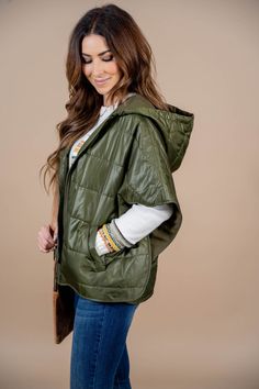 A cross between a poncho and a vest! This provides an extra layer of warmth and can tie together the simplest of outfits! We love to add this over a sweater, sweatshirt, basic tee, or even a fun blouse for everyday wear! 100% PolyesterLining: 100% Polyester Green Cozy Outerwear For Layering, Cozy Green Outerwear For Layering, Casual One-size Poncho For Layering, Casual Green One Size Outerwear, Casual Green One-size Outerwear, Versatile Hooded Top For Fall, Comfy Everyday Outerwear For Spring, Comfy Everyday Spring Outerwear, Casual Poncho For Spring Loungewear