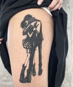 a person with a black and white tattoo on their thigh is holding onto another person's leg