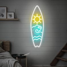 a neon surfboard is hanging on the wall