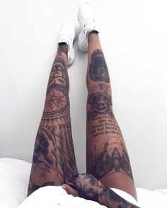 a person with tattoos on their legs and feet