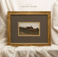 a painting on display in a gold frame with the words nish art gallery above it