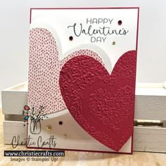 a valentine's day card with a red heart on the front and white background