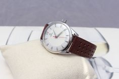 This is a men's vintage from 1956 Omega mechanical hand winding watch. It works and keeps time well, The movement has been serviced. Cams with the free gift box; https://www.etsy.com/listing/810262694/gift-box?ref=shop_home_active_1&frs=1 Condition: very good Case: stainless steel; polished; lug to lug 43mm; width without crown 35mm Case back: stainless steel Crystal: acrylic; new; free of any scratches Dial: two tone; restored Crown: Omega Band: new; hand made; dark brown genuine leather; w Retro Brown Watch Accessories For Formal Occasion, Retro Chronometer Watch Accessories For Business, Retro Formal Watch Accessories With Subdials, Vintage White Automatic Watch Accessories, Vintage Brown Watch Accessories For Anniversary, Vintage White Watch Accessories With Round Dial, Vintage White Round Dial Watch Accessories, Retro White Watches For Formal Occasions, White Retro Watch For Formal Occasions