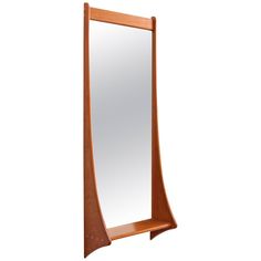 a wooden shelf with a mirror on it