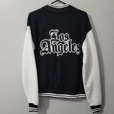 Eighty Eight Black And White Varsity Jacket Size Small Old English Letters On Back. Looks Like A Jacket Feels Like A Sweater White Letter Print Track Jacket For Streetwear, White Track Jacket With Letter Print For Streetwear, White Crew Neck Varsity Jacket For Fall, White Varsity Outerwear With Crew Neck, White Varsity Crew Neck Outerwear, Urban Style White Track Jacket For College, White Urban Crew Neck Outerwear, White Crew Neck Urban Outerwear, White Varsity Track Jacket With Long Sleeves