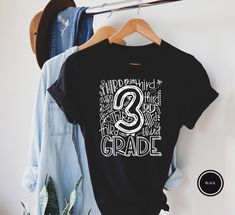 "3rd Grade Typography T-Shirt Hi! Welcome to my store, I'm delighted to see you here. My store's main goal is to provide you with premium everyday apparel with the best graphic t-shirts.  DESCRIPTION * Printed and shipped from the USA. * We use state of art printing on soft and quality shirts. * Different size options; crewneck, youth, women's v-neck, toddler, and baby size options.  * Effective customer service and expedited shipping.  * Solid colors are 100% airlume combed and ringspun cotton.  * Heather colors 52/48 cotton/polyester. * Shoulder taping. Side-seamed. Fitted at bicep. Tear-away label. 4.2 oz. SIZES AND COLORS:  * Please refer to the size charts for measurements before placing an order. * You can compare our numbers to one of your favorite shirts to make sure. * Unisex shir Grateful Shirt, School Spirit Shirts, Third Grade Teacher, Church Shirt, Cross Shirts, Typography T Shirt, Elementary School Teacher, Spirit Shirts, Teacher Tees