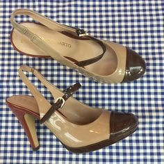 Amazing vintage platform Mary Jane heels!  Terrific patent leather in two tone brown and tan. These heels are very high and fully patent leather (heels are patent too).  Slingbacks with rounded toe and buckle strap. Designer:  Franco Sarto Stamped women's size 7M. Measurements:  7.75" long 3" across ball of foot 4.25" heel In good vintage condition with light wear. Shipping: USPS Standard Post (insurance tracking included) We are happy to ship internationally! *Due to the variability in shipping costs based on location, anything in excess of $2.00 over the actual cost will be refunded.  We can provide a combined shipping cost and/or estimate to your location. Refunds and Exchanges: All sales are final.  You will not be refunded if an item does not fit. Please check the measurements careful Luxury Retro Platform Heels, 90s Shoes Women Retro, Cheap Vintage Leather Heels, Luxury Fitted Retro Heels, Luxury Vintage Heels With Block Heel, Luxury Vintage Block Heel Heels, Luxury Vintage Heels With Wooden Heel, Luxury Vintage Heels For Fall, Luxury Retro Heels