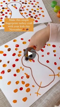 a child is making a turkey craft with crayons on the paper and glue