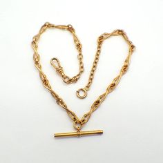 "Antique yellow gold-filled pocket watch chain, made of infinity form links, partially decorated with textured finish. This splendid chain is 16 1/2\" long, 5.8 mm wide and weighs 22.24 grams. EA3416" Formal Rope Chain Necklace, Vintage Gold Necklace With Hooks And Links, Vintage Gold Necklace With Hook And Links, Formal Wheat Chain Link Necklace, Antique Style Formal Chain Necklace, Vintage Oval Link Chain Necklace For Formal Occasions, Victorian Gold Link Chain Necklace, Victorian Style Gold Link Chain Necklace, Victorian Curb Chain Necklaces