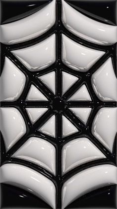 a black and white spider web tile pattern