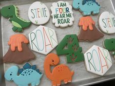 decorated cookies in the shape of numbers and dinosaurs