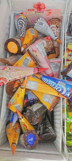 a white basket filled with assorted candy