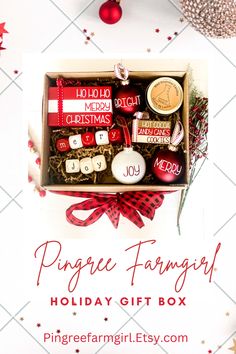 a christmas gift box filled with holiday items