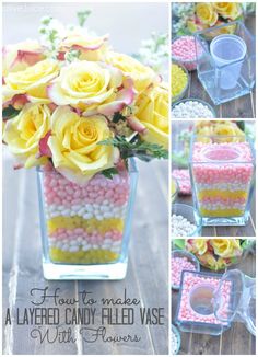 yellow roses in a glass vase filled with candy and marshmallows for centerpiece