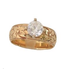 a gold ring with a white diamond in the center