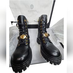 Authentic Versace 45 Calf Leather Combat Boots Featuring Lace Up Closer With Gold Tone Eyelets, Black Leather Front Strap With Gold Tone Medusa Buckle Details. Platform Sole And Side Zip Closer. Brand New With The Box And Dust Cover. I Bought These Myself From Versace. They Will Go Through Poshmark Authentication. Size 39 U.S Womens Size 9 Black Boots With Gold Chains, Combat Boots With Gold Hardware, Black And Gold Biker Boots, Versace Long Boots, Versace Leather, Black Leather Combat Boots, Leather Combat Boots, Versace Shoes, Swim Shoes