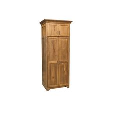 a tall wooden cabinet sitting on top of a white wall