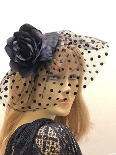 "Polka Dot Veil Fascinator is flirty and fun and is so versatile it can be worn to the Derby, a cocktail party, or church! Black polka dot tulle covers a sinamay black hat base and surrounds the sides of the base to partially cover the face. A large black rose sits on top adding a touch of elegance to any outfit. The black fascinator attaches to the hair with your choice of two unseen alligator clips or a satin wrapped head band. You choose if you prefer to wear it on the right or left side of y Polka Dot Veil, Veil Fascinator, Black Fascinator, Sinamay Hats, Fabric Flower Brooch, Church Hat, Flower Fascinator, Hat Base, Kentucky Derby Hats