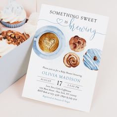 there is a box of cupcakes and a card with the words something sweet is brewing on it