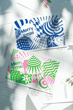 several christmas cards are laying on top of each other with the words merry xmas printed on them