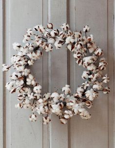 a wreath is hanging on the front door