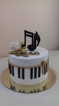 a cake decorated with musical notes and flowers