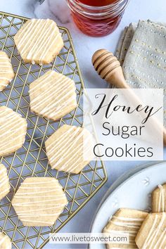 honey sugar cookies on a cooling rack next to a cup of tea