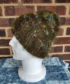 "Hand Knitted Super Soft Forest Green Flecked Beanie   One size fits all. 10\" from top to rim. 70% Mohair.   Can be worn with our without brim.   Made at home by me.     Orders taken.  For instance if you would like a larger hat I can knit you one.   Money back if not as described." Green Knit Crochet Hat, Moss Clothes, Moss Sweater, Forest Hat, Mohair Hat, Quirky Girl, Chunky Beanie, Cable Knit Hat, Surfer Style