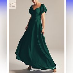 a woman in a long green dress