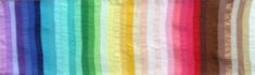 a rainbow colored curtain hanging in front of a window