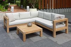 a couch and coffee table on a patio