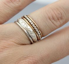 Beautiful mix of stacking rings. Rings are sterling silver and 14k rose gold filled. Stackable rings. Set of 5. Two 14K rose gold filled rings (1 smooth, 1 textured) Three .925 Sterling silver rings (1 textured, 1 twist ring, and one thick patterned ring) If you don't see your size or are interested in a different mix of rings, please feel free to message me. All orders ship in a gift box. If you are ordering multiple items and want them boxed separately, please let me know in the notes at check Handmade Sterling Silver Stackable Rings In Rose Gold, Stackable Rose Gold Sterling Silver Midi Rings, Handmade Rose Gold Sterling Silver Stackable Rings, Heirloom Rose Gold Stackable Rings, Nickel-free Sterling Silver Rose Gold Rings, Nickel-free Rose Gold Sterling Silver Rings, Heirloom Style Rose Gold Stackable Sterling Silver Rings, Heirloom Rose Gold Stackable Sterling Silver Rings, Anniversary Sterling Silver Stackable Rings In Rose Gold