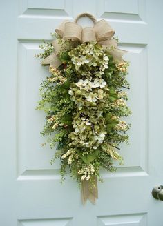 a white door with a wreath on it