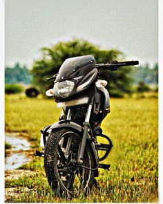 a motorcycle parked in the middle of a field