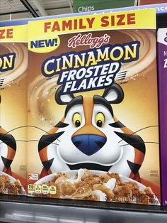 two boxes of cinnamon frosted flakes are for sale in a grocery store aisle